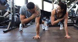 Toning Bingo Wings: Your Ultimate Guide to Sculpting Sleek Arms at the Gym 3 Fitness trainer demonstrating arm toning exercises Leigh-on-Sea