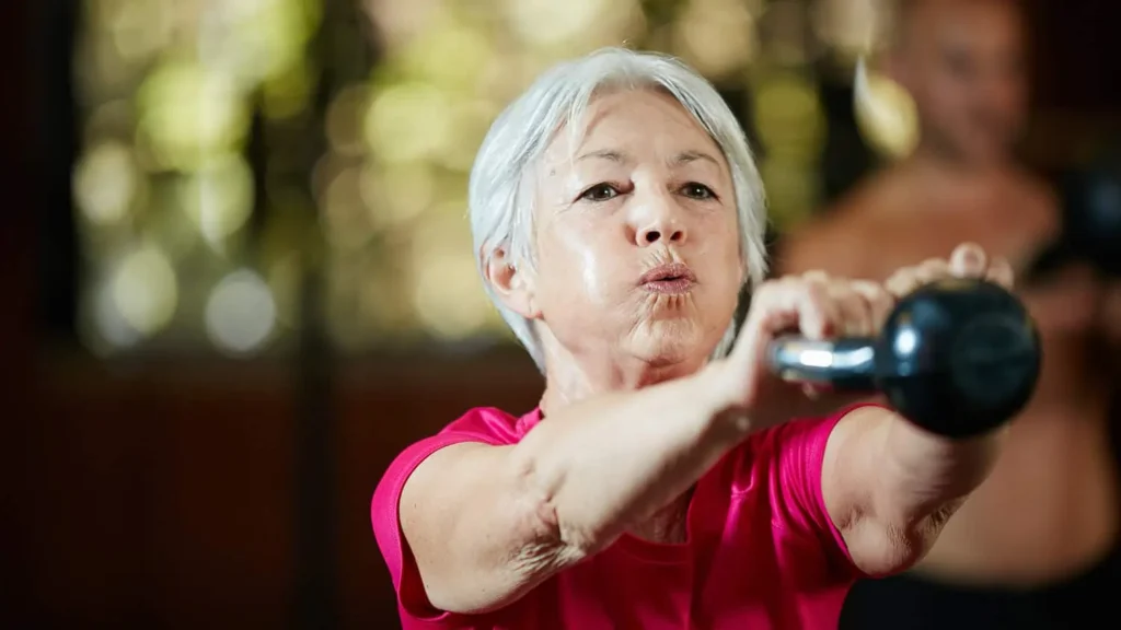 Toning Bingo Wings: Effective Exercises and Tips for Achieving Sleeker Arms 2 Person performing arm exercises with dumbbells Leigh-on-Sea