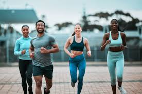 Sculpting Sleek Arms: The Essential Role of Cardio in Toning Without Bulking Up 3 image of people running to incorporate cardio Leigh-on-Sea exercise into their life to help tone arms and body.